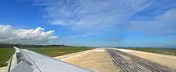 The wing view from an Airbus A320 backtracking at the end of runway 09.