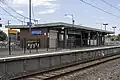 North-west bound view of station building on Platform 1, January 2023