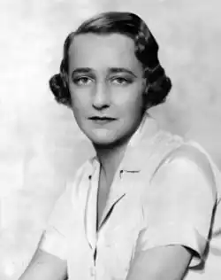 head and shoulders shot of a youngish white woman with medium-length dark hair