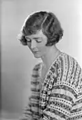 Half-length, left profile, wearing striped knitted jumper -- Half-length, to right, looking down, wearing striped knitted jumper