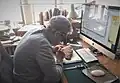 Stolper transliterating Persepolis Fortification tablets in his office at the Oriental Institute.