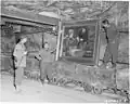 The painting was brought along with other pictures from the German National Gallery to a mine to protect it from the bomb war in World War II. This 1945 photograph shows US soldiers with the painting in the Merkers salt mine.