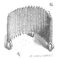 A wicker U-shaped mantlet on wheels. Wicker was a popular material for siege defences as it was lightweight, effective and easy to construct. The wheels add further mobility which meant that the user could move forward slowly but surely.