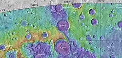 Part of Uzboi Vallis along with nearby craters. Colors relate to elevation.