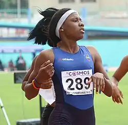 Young Black woman running