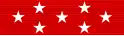 Red ribbon with seven white stars: a row of three stars across the center, and rows of two stars above and below