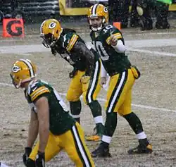 Flynn in uniform in the snow playing football