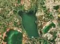 Satellite imagery of the reservoir. Floating solar panels can be seen.