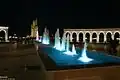 Nighttime view of the Nine Towers from the fountains