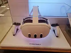 A Meta Quest 3 display unit with its controllers.