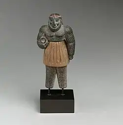 Male figure; late 3rd–early 2nd millennium BC; chlorite, calcite, gold and iron; height: 10.1 cm; Metropolitan Museum of Art