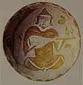 Iraq or Egypt. Abbasid era rubab, painted on the inside of a bowl, 10th century CE. Appears to be spike lute (the neck inserted into the body, beneath the soundboard. The instrument has two strings.