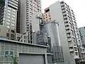 Wood handling building and storage silo