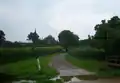 North Witham from the south side of the River Witham which is visible in the foreground. This photo shows the changes that have occurred in the village over the last 50 years when compared to the painting from the 1950s seen elsewhere in this article.