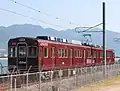 An ex-Nose Electric Railway 1500 series converted to a "MIHARA-Liner" test train at Mitsubishi Heavy Industries's test track at Mihara