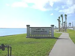 A welcome marker at the entrance for the Town of Ocean Breeze