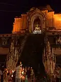 Offerings to a Buddha image at Wat Chedi Luang during Tam Bun Khan Dok
