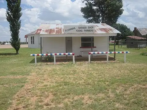 The barbershop in Fluvanna, Texas, was restored in 2010 as part of a pioneer village in Snyder in Scurry County in West Texas.[34]
