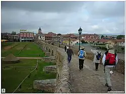 In 1433 on this spot—the bridge over the river Órbigo—Suero de Quiñones and ten of his knights challenged all comers to a Pas d'Armes, promising to "break 300 lances" before moving on.