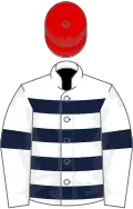 White, dark blue hoops and armlets, red cap