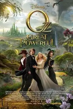 A man and three woman standing on a yellow brick road