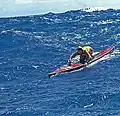 Paddleboarding in big waves