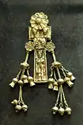 Pendant representing a naked woman. Electrum, made by a Rhodian workshop, ca. 630-620 BC. Found in the necropolis of Kameiros (Rhodes).