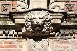Pins: lion mufles once used as a gargoyle.
