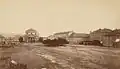 Early photo of Triple Cross Square, with Church in background (1880s)