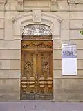 Entrance door to the building with initials and date of completion (BMB 1902)