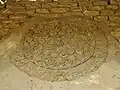 Detail of a carved stucco roundel on the southwestern façade