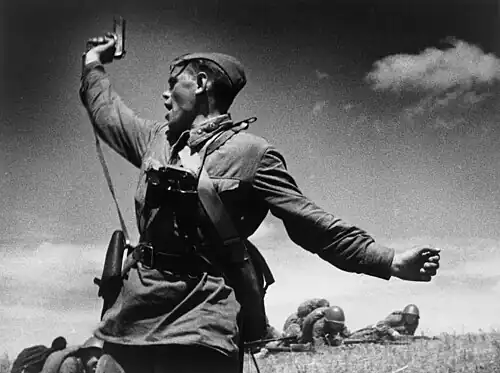 Image 3 Kombat Photograph credit: Max Alpert Kombat (Russian for 'battalion commander') is a black-and-white photograph by Soviet photographer Max Alpert. It depicts a Soviet military officer, armed with a TT pistol, raising his unit for an attack during World War&nbsp;II. This work is regarded as one of the most iconic Soviet World War&nbsp;II photographs, yet neither the date nor the subject is known with certainty. According to the most widely accepted version, it depicts junior politruk Aleksei Gordeyevich Yeryomenko, minutes before his death on 12&nbsp;July&nbsp;1942, in Voroshilovgrad Oblast, now part of Ukraine. The photograph is in the archives of RIA Novosti, a Russian state-owned news agency. More selected pictures