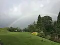Rainbow over motte, bailey and ditch