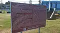 Board explaining the historical significance of Rémy Ollier.