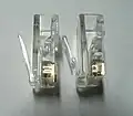 8P8C plug with contacts for solid wire (left) and stranded wire (right)