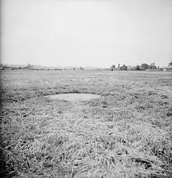 The turret of a Pickett-Hamilton retractable fort, retracted to ground level on a fighter airfield in Southern England.