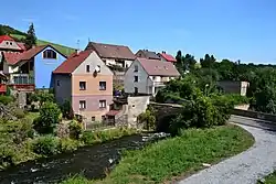 Houses on the left bank of the Bílina river