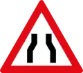 Roadway narrows from both sides ahead