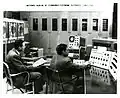 Horace Joseph and George A. Moore using the SEAC image scanner to analyze metallurgical photographs in 1960. Moore was legally blind.[13]
