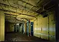 The ship's first-class restaurant, stripped of asbestos and furnishings. The entire ship is in a similar state.