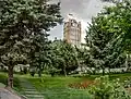 Western side of Municipality Building and Sa'at Tower, a view from the municipality garden.