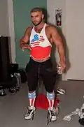 Gay porn star François Sagat man wearing a cropped vest