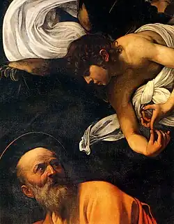 Matthew writes his Gospel, guided by an angel.