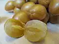 A hybrid, seedless wampee that is larger and juicier than the normal variety; however, it is still more sour than sweet.