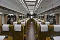 The interior of car 1 (gold-coloured seats); Semboku Liner