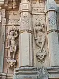 Salabhanjika style statues adoring the outside wall of the temple.