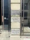 Historic signage revealed next to the entrance, 2023