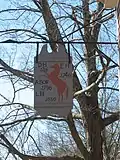 Sign with initials of previous owners of the inn