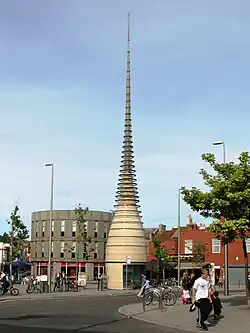 A tapering tower, with metal hoops around the upper part.