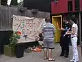 Families paint on the Pride banner, which became an annual tradition.